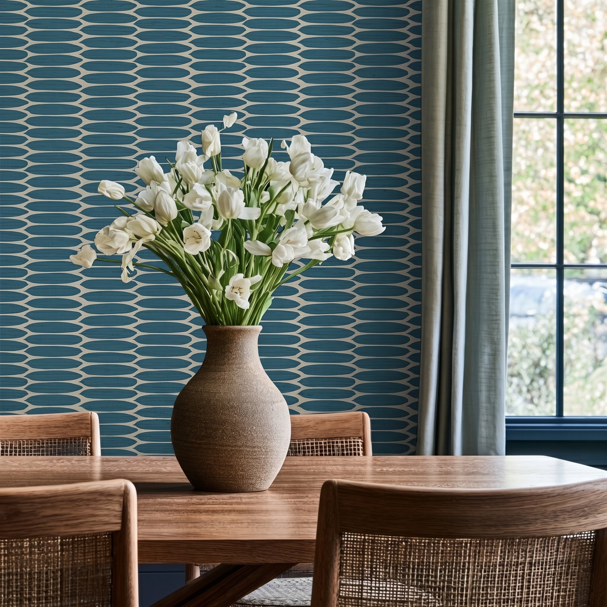 Dining vignette with teal grasscloth walls, brass accents, and fresh tulips